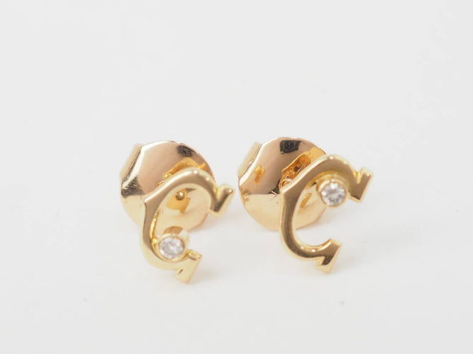 Boucles d'oreilles Boucles d'oreilles Puces Cartier C en or jaune et diamants 58 Facettes 33295