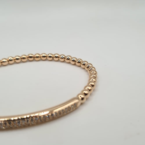 Bracelet or rose 18 carats en billes d’or et barrette de diamants naturels