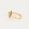 Bague 57 Bague marguerite or jaune, rubis et diamants 58 Facettes