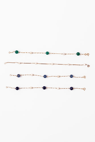 Bracelet Lot de quatre bracelets en or jaune et perles 58 Facettes