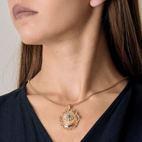 Pendentif Pendentif porte souvenir en or rose, turquoise et perles 58 Facettes CHAL0374