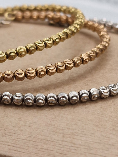 Bracelet Bracelets triple rang de perles en or blanc jaune et rose 18 kt 58 Facettes