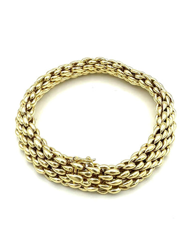 Bracelet CHAUMET. Bracelet vintage or jaune 18K 58 Facettes