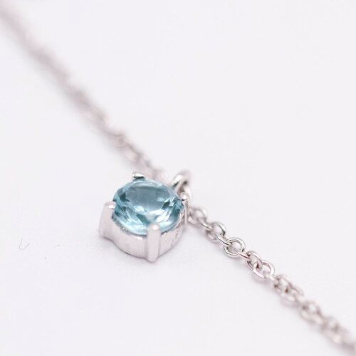 Collier BELL en or blanc et topaze bleue