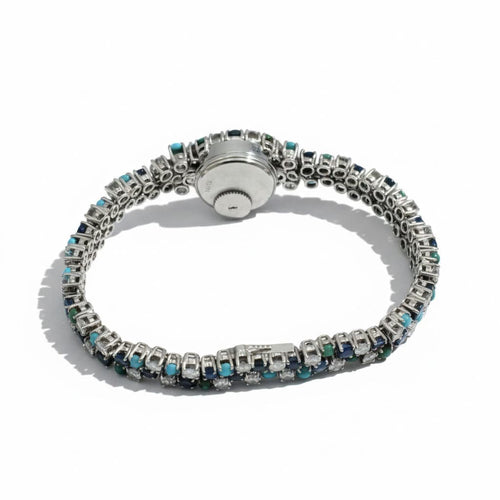 Montre Uti - Montre Ovale - Or Blanc - Diamants, Saphirs et Turquoise 58 Facettes 1.0001001/1