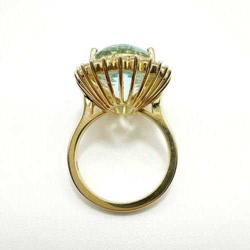 Bague 55 Bague en or jaune de haute joaillerie ornée d'une aigue-marine et d'un halo de diamants 58 Facettes 50357