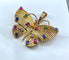 Pendentif papillon en or jaune et pierres précieuses