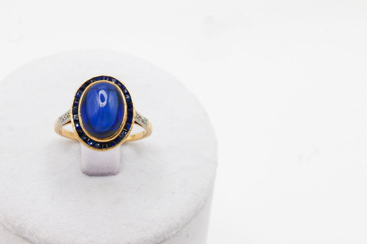 Bague Bague or jaune, platine, saphir cabochon 58 Facettes 250101