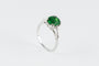 Bague 50.5 Bague en or gris serti d’un grenat tsavorite et brillants 58 Facettes 196348