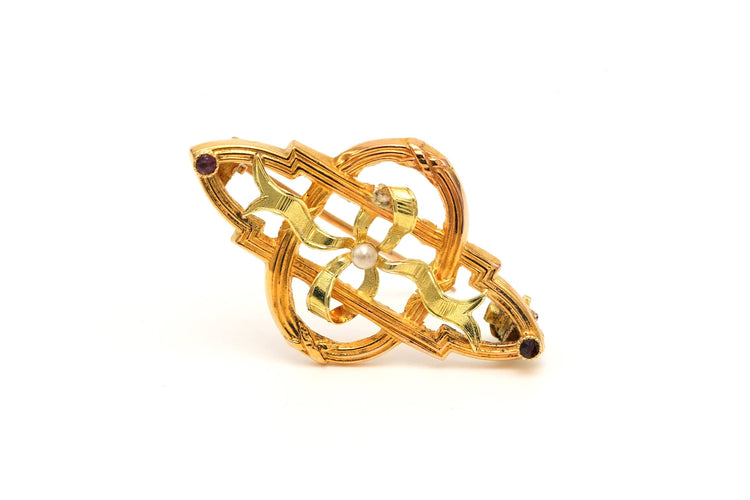 Broche Broche Art Nouveau en or jaune sertie d'une perle et de rubis 58 Facettes 22963