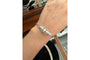 Bracelet Bracelet en or blanc avec perles et diamants 58 Facettes 10232