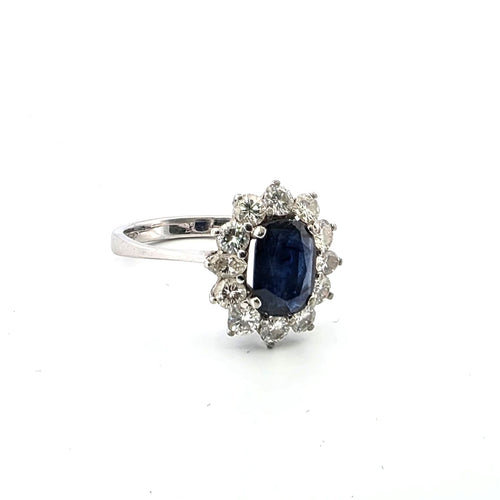 Anello en or blanc avec saphir central et diamants