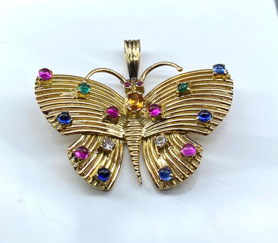 Pendentif papillon en or jaune et pierres précieuses