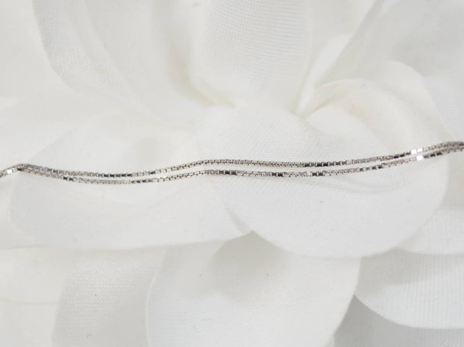 Collier Collier en or blanc et 4 coeurs 58 Facettes 26383