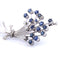 Broche Broche en or blanc 18 carats - Saphirs et diamants 58 Facettes