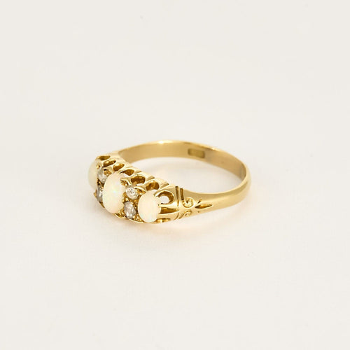 Bague 58 Bague type jarretière en or jaune, opales et diamants roses 58 Facettes MAR0975