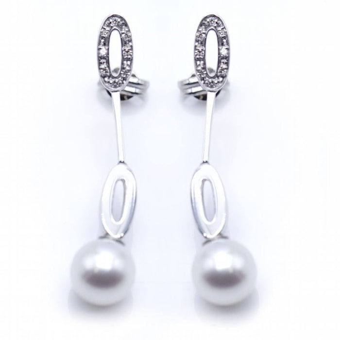 Boucles d'oreilles Boucles d'oreilles longues en or blanc et perles 58 Facettes N102863LF