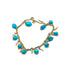 Bracelet en or jaune avec perles turquoise et breloques décoratives