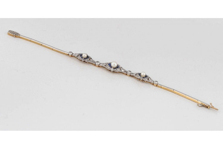 Bracelet Bracelet Art Déco avec diamants, perles et saphirs synthétiques en or jaune et platine 58 Facettes 9530