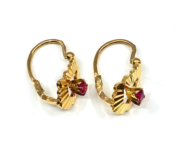 Boucles d’oreilles dormeuses en or jaune 18 carats et pierres rouges
