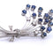 Broche Broche en or blanc 18 carats - Saphirs et diamants 58 Facettes