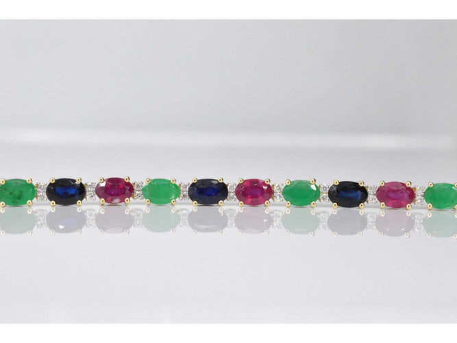 Bracelet Bracelet tennis en or avec diamants, saphir, rubis et émeraude 58 Facettes 2069