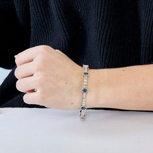 Bracelet jonc ouvrant en or jaune et argent, diamants et saphirs 58 Facettes 230460