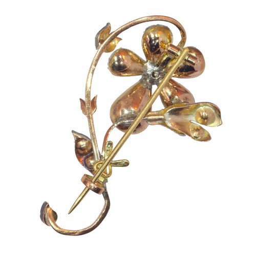 Broche Beauté épanouie : la broche victorienne en forme de branche de fleur en or rouge et argent 58 Facettes 23031-0050
