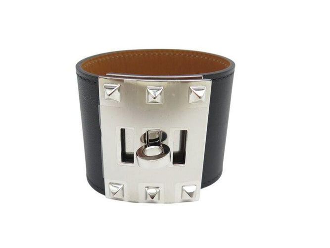 Bracelet bracelet HERMES extreme kelly dog manchette en cuir noir 50mm 58 Facettes 267199