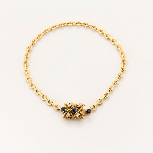 Bracelet Bracelet torsadé en or jaune saphir et diamants. 58 Facettes