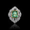 Bague Art Déco en or jaune et blanc sertie d'une émeraude.