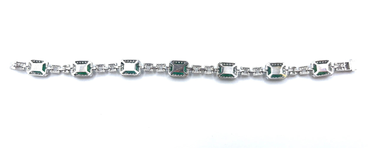 Bracelet Bracelet rivière en or gris, émeraudes et diamants 58 Facettes