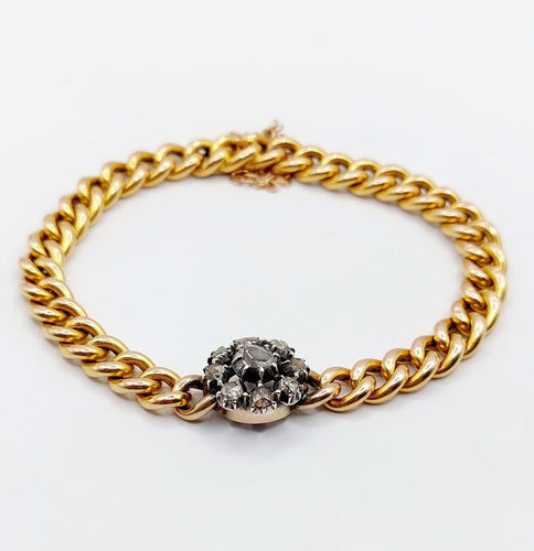 Bracelet Bracelet or jaune et argent, marguerite ornée de diamants 58 Facettes A05479