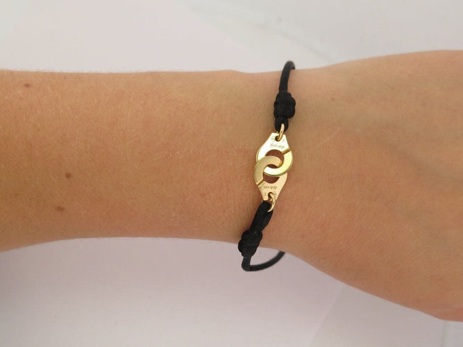 Bracelet bracelet DINH VAN menottes r10 341102 en or jaune 18k 2.9gr & cordon noir 58 Facettes 270151
