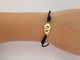 Bracelet bracelet DINH VAN menottes r10 341102 en or jaune 18k 2.9gr & cordon noir 58 Facettes 270151
