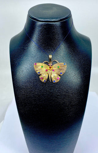 Pendentif papillon en or jaune et pierres précieuses