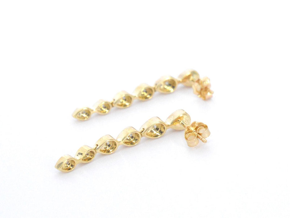 Boucles d'oreilles en or jaune avec diamants