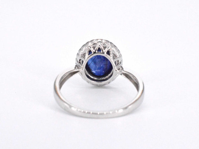 Bague 54 Bague entourage en or blanc avec diamants et saphir 58 Facettes 2044