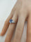 Bague 53.5 Bague pierre bleue ovale entourage de diamants en or gris 18k 58 Facettes LP1800