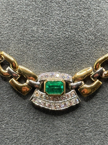 Collier Collier ras-de-cou en or jaune et blanc des années 1980, orné d'émeraudes et de diamants 58 Facettes