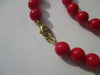 Collier Collier choker corail rouge fermoir or 58 Facettes