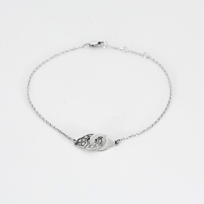 Bracelet DINH VAN - Menottes R8 - Bracelet or blanc et diamants 58 Facettes 240627