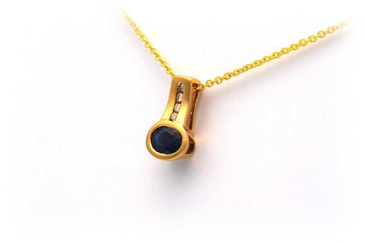 Pendentif Pendentif contemporain en or jaune, serti de diamants et d'un saphir 58 Facettes 10078