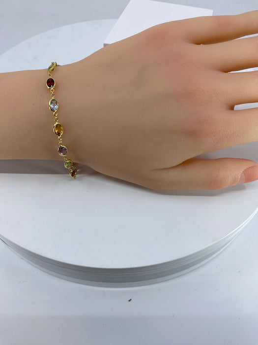 Bracelet or jaune et pierres fines