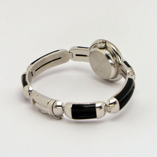 Montre Montre Chopard Genève en or blanc 18 carats avec onyx et diamants 58 Facettes