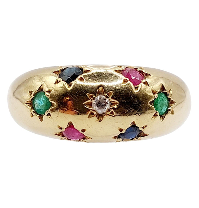 Bague jonc bombé or jaune ornée de saphir, rubis, diamant et émeraudes en serti étoilé