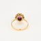 Bague 57 Bague marguerite or jaune, rubis et diamants 58 Facettes