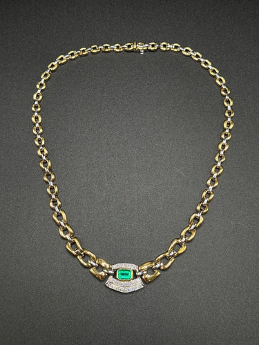 Collier Collier ras-de-cou en or jaune et blanc des années 1980, orné d'émeraudes et de diamants 58 Facettes