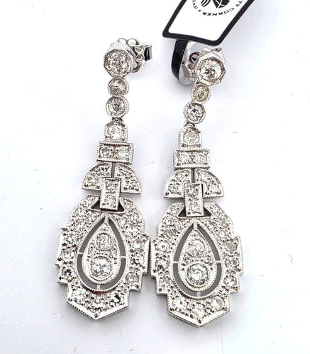 Boucles d'oreilles en platine massif serties de diamants