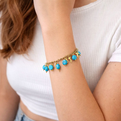 Bracelet Bracelet en or jaune avec perles turquoise et breloques décoratives 58 Facettes 50402